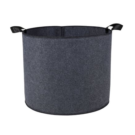 Black fabric grow bag with handles for easy transportation and drainage holes for optimal plant health. This bag is ideal for cultivating various herbs, flowers, and vegetables in small spaces, preventing overwatering with its breathable fabric design.
